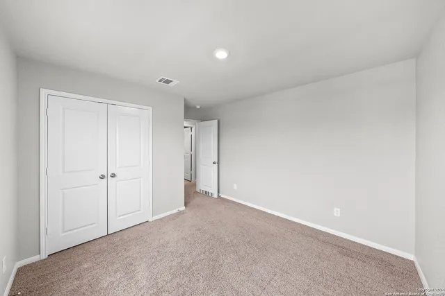 a bathroom with a granite countertop sink a toilet and bathtub