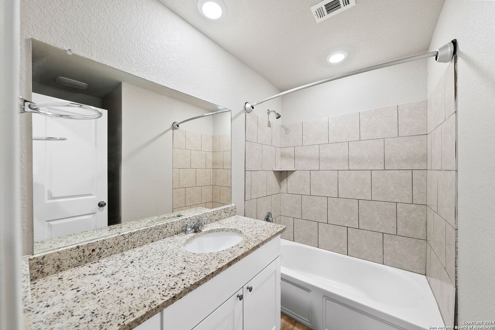 10535 Margarita Loop Converse, TX 78109 - Photo 42 of 51 a bathroom with a granite countertop sink a toilet and bathtub