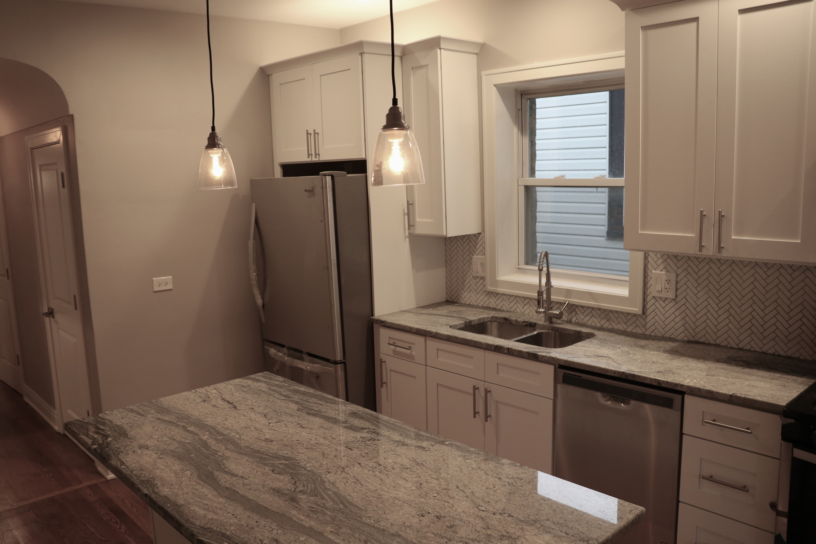 1307 West Fillmore Street Chicago, IL 60607 - Photo 11 of 42 a kitchen with a sink and a refrigerator