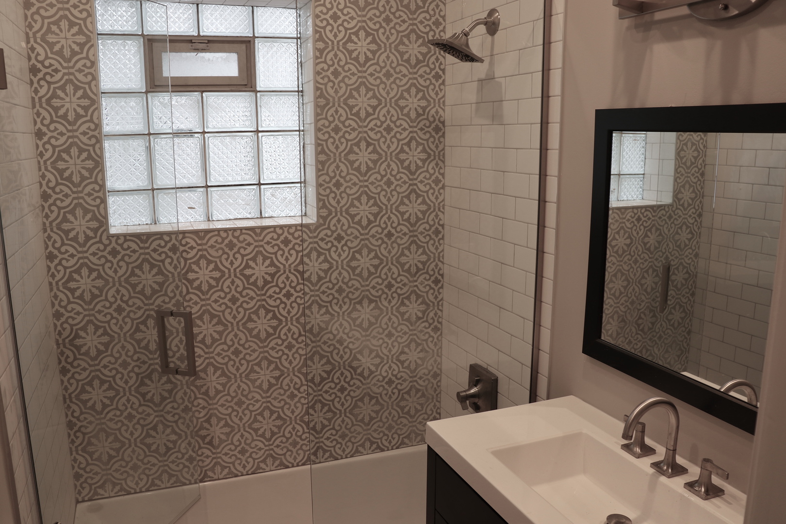 1307 West Fillmore Street Chicago, IL 60607 - Photo 17 of 42 a bathroom with a sink and a mirror