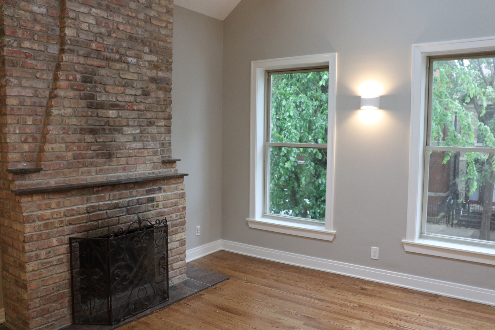 1307 West Fillmore Street Chicago, IL 60607 - Photo 21 of 42 a view of an empty room with wooden floor and a window