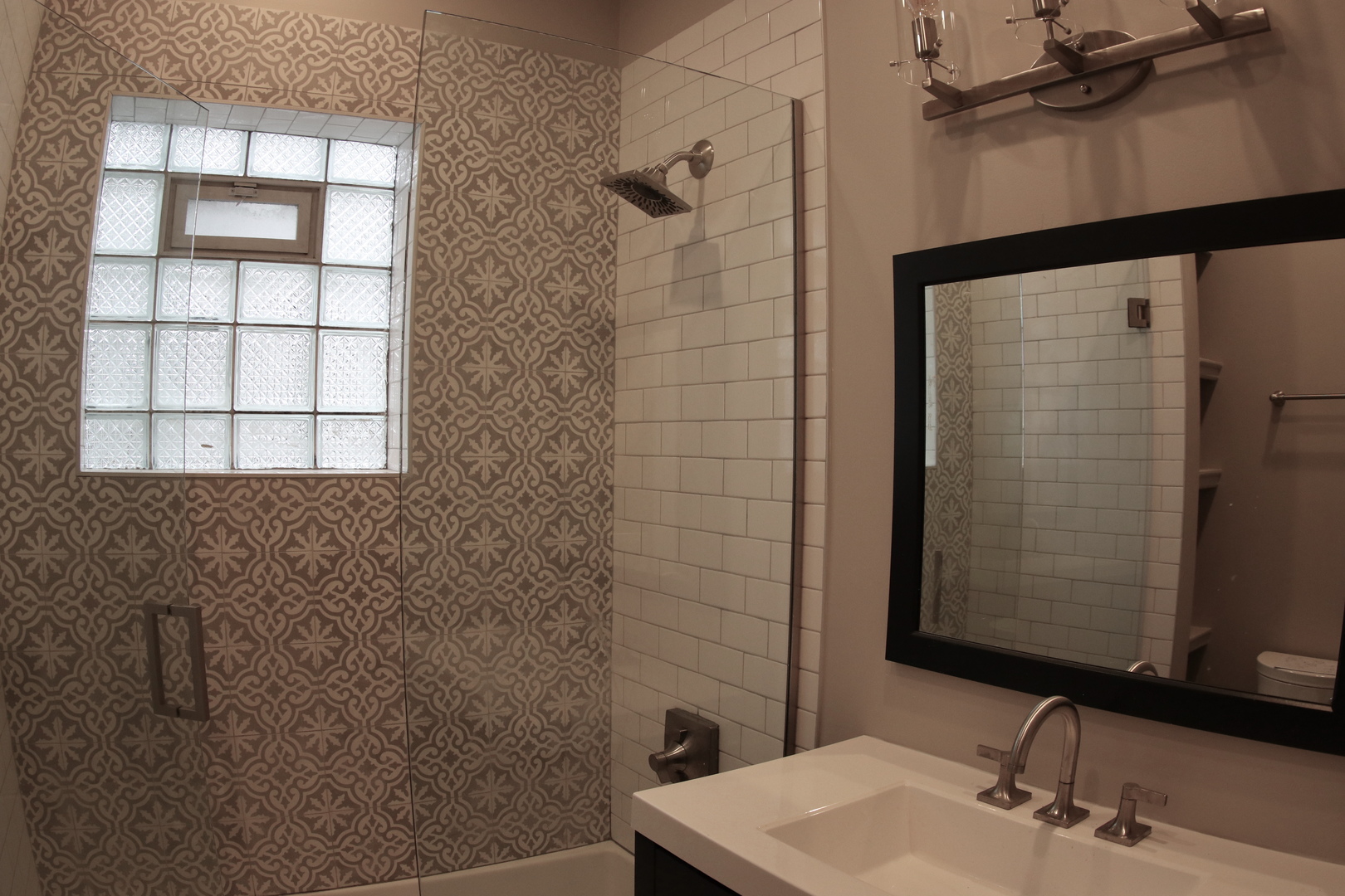 1307 West Fillmore Street Chicago, IL 60607 - Photo 29 of 42 a bathroom with a sink and a mirror
