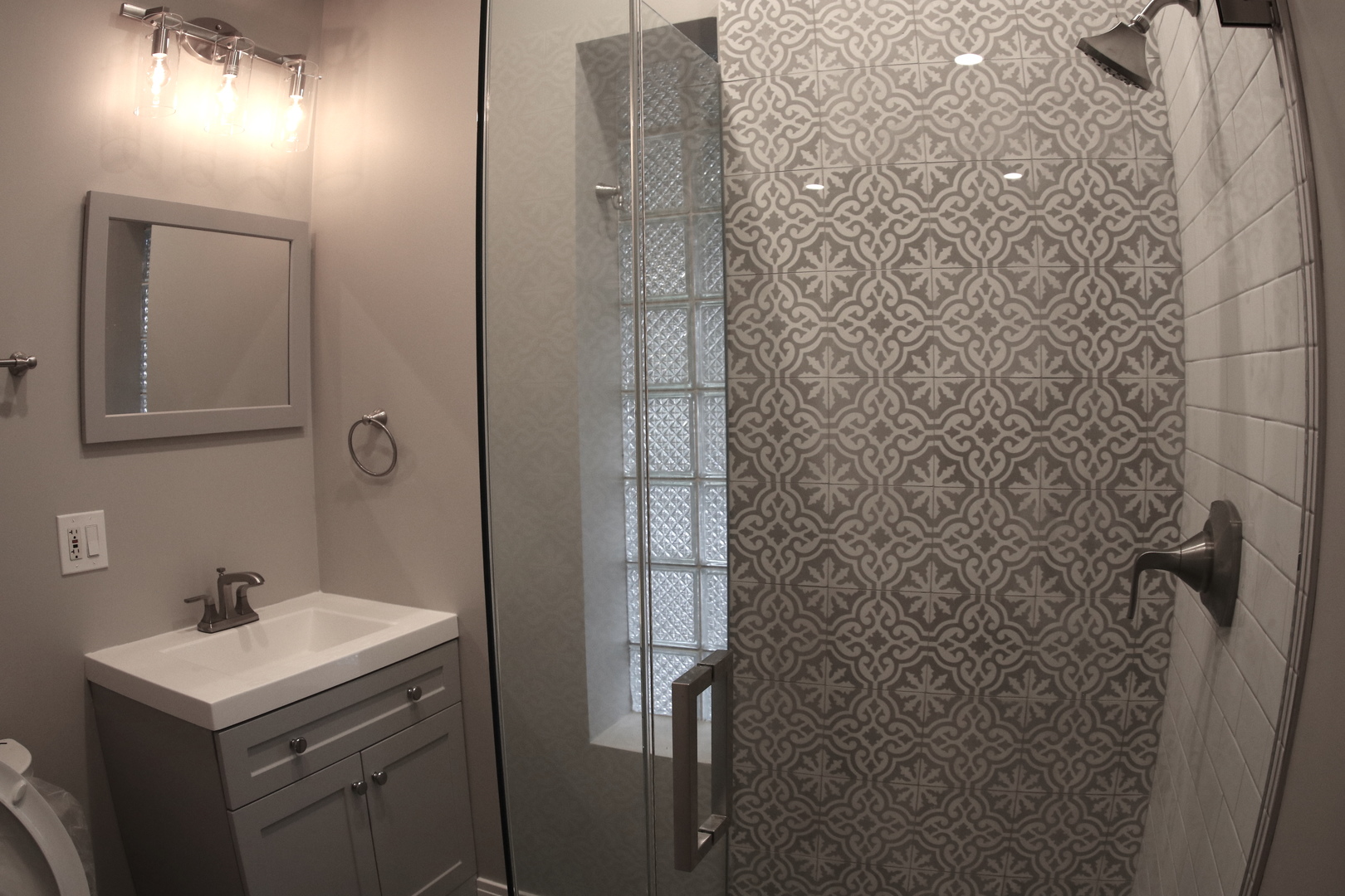 1307 West Fillmore Street Chicago, IL 60607 - Photo 30 of 42 a bathroom with a sink a toilet and shower