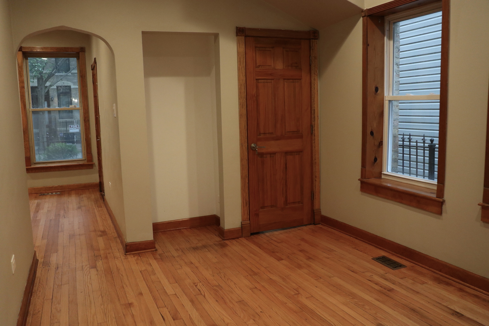 1307 West Fillmore Street Chicago, IL 60607 - Photo 8 of 42 an empty room with wooden floor and windows