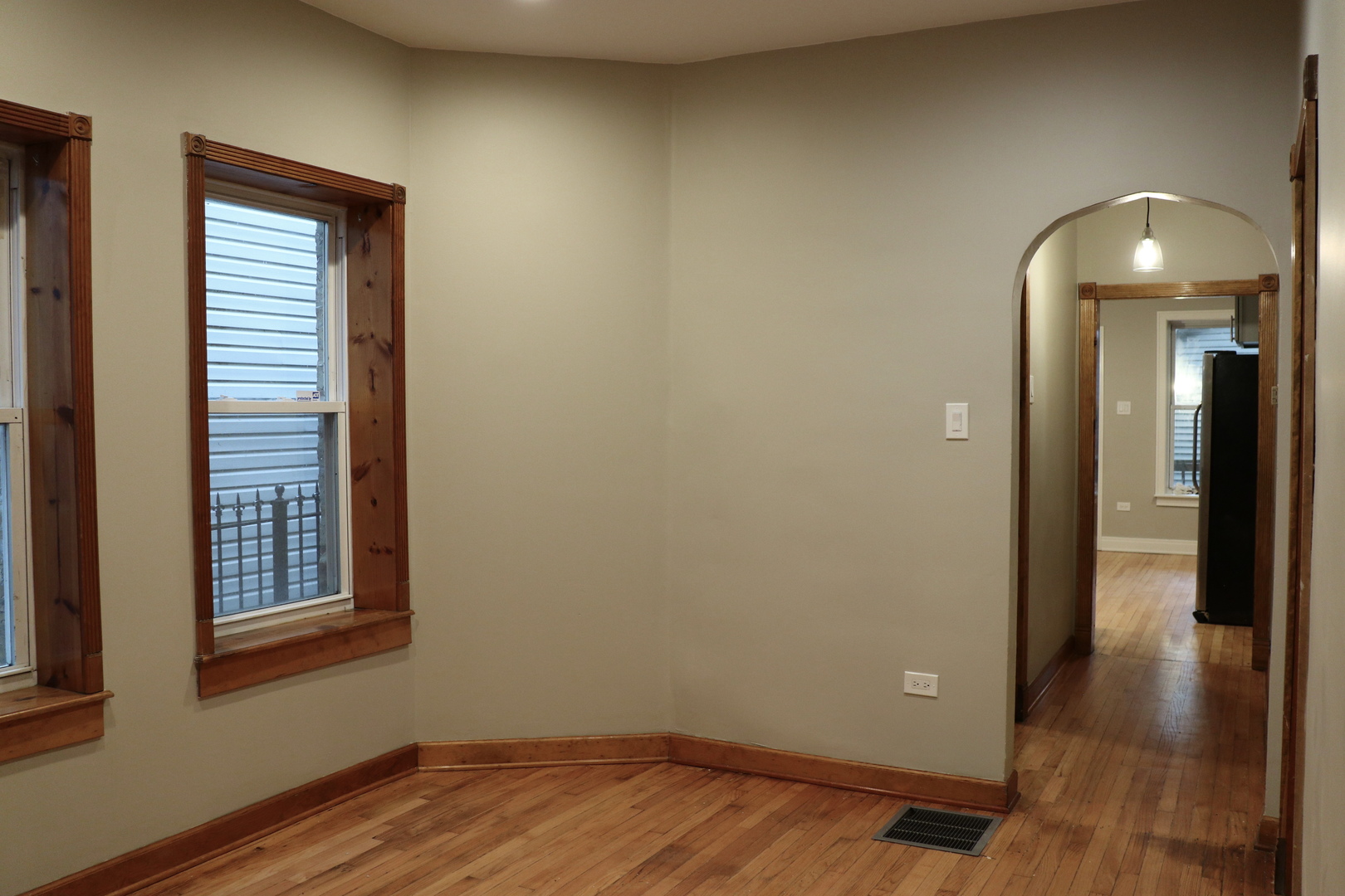 1307 West Fillmore Street Chicago, IL 60607 - Photo 9 of 42 an empty room with wooden floor and windows