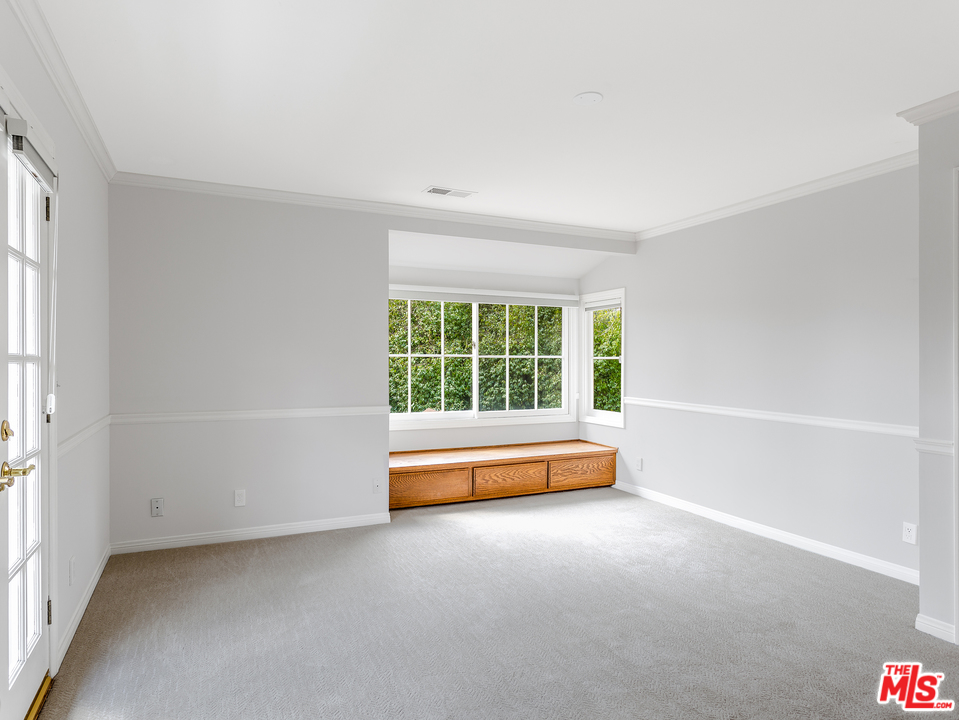 24835 Jacob Hamblin Road Hidden Hills, CA 91302 - Photo 17 of 29 a view of a room with furniture and a window