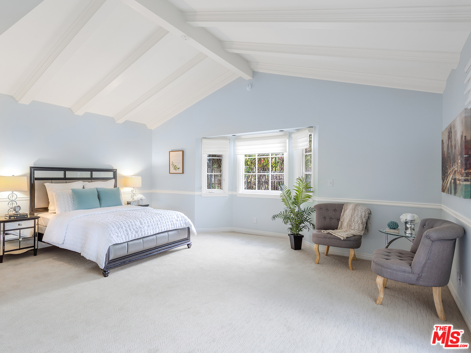 24835 Jacob Hamblin Road Hidden Hills, CA 91302 - Photo 18 of 29 a bedroom with a bed and window