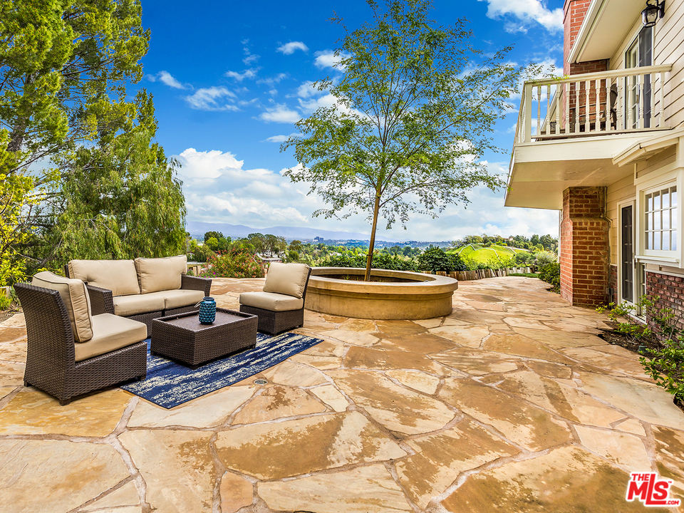 24835 Jacob Hamblin Road Hidden Hills, CA 91302 - Photo 22 of 29 a view of a patio with couches and potted plants