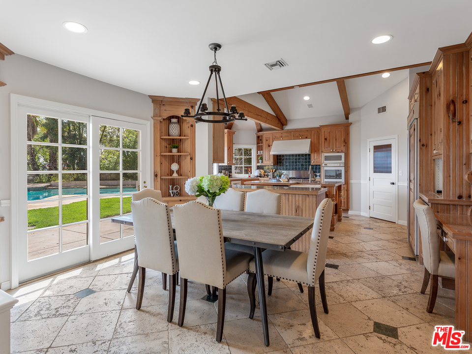 24835 Jacob Hamblin Road Hidden Hills, CA 91302 - Photo 5 of 29 a view of a dining room with furniture window and wooden floor
