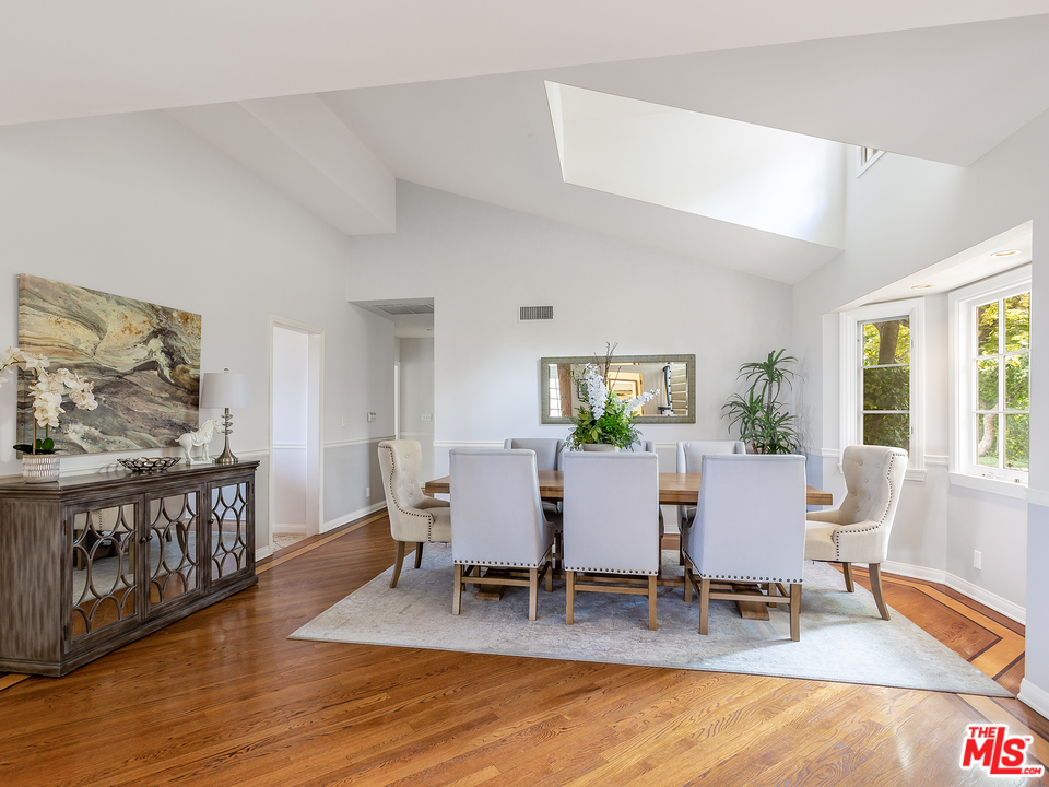 24835 Jacob Hamblin Road Hidden Hills, CA 91302 - Photo 6 of 29 a view of a dining room with furniture window and wooden floor