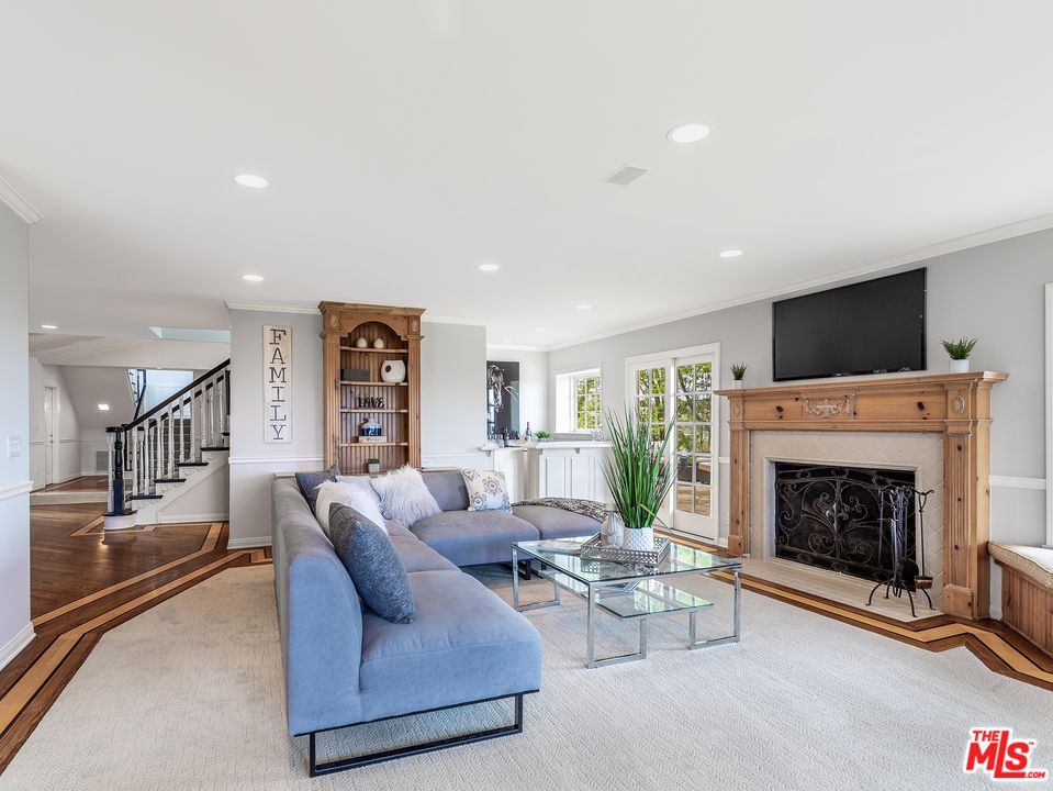 24835 Jacob Hamblin Road Hidden Hills, CA 91302 - Photo 7 of 29 a living room with furniture and a fireplace