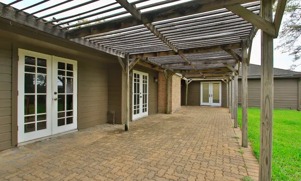 a view of a backyard with wooden fence