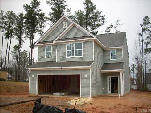 1209 Lombar Street Raleigh, NC 27610 - Photo 1 of 1 a front view of a house with yard