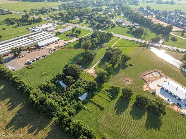 an aerial view of a house with a lake view