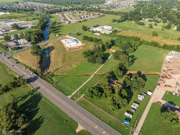 an aerial view of a residential houses with outdoor space