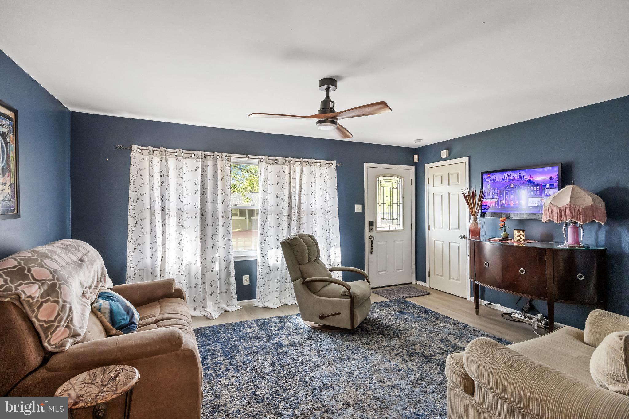 109 North Ambler Road Somers Point, NJ 08244 - Photo 4 of 22 a living room with furniture a ceiling fan and a window