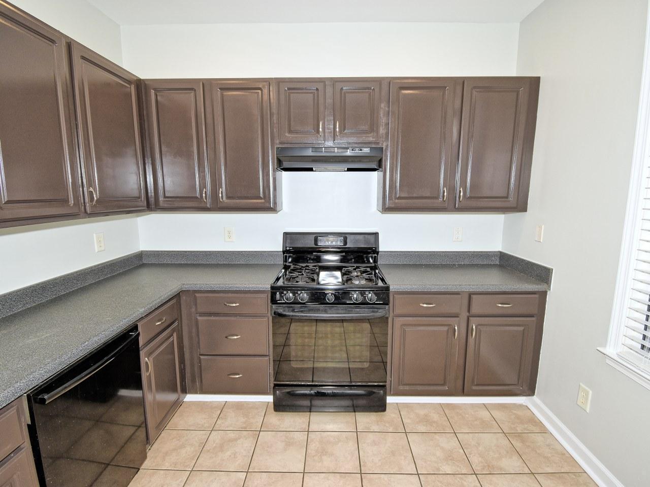 2245 Long Pine Lane Raleigh, NC 27603 - Photo 12 of 33 a kitchen with a stove and a cabinets