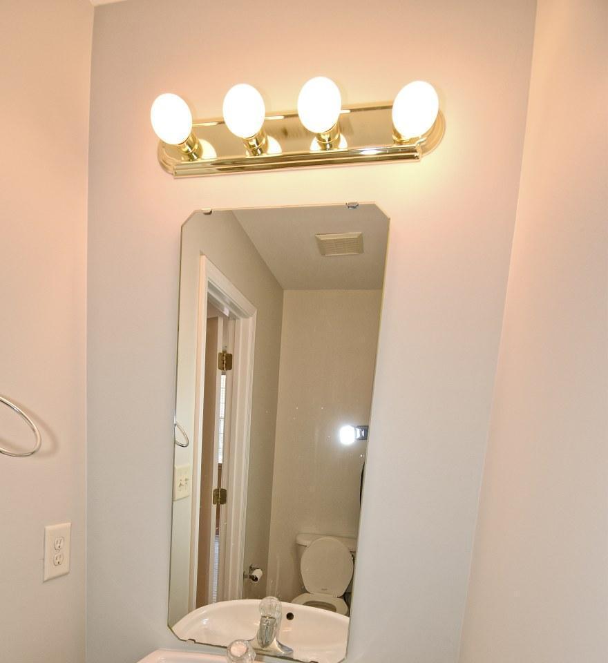 2245 Long Pine Lane Raleigh, NC 27603 - Photo 16 of 33 a bathroom with a mirror and vanity