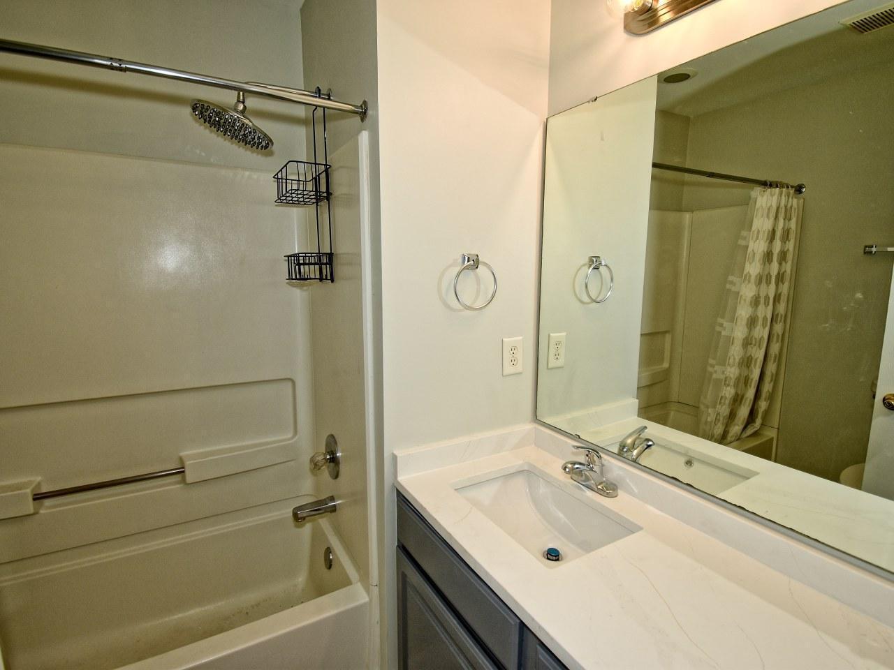 2245 Long Pine Lane Raleigh, NC 27603 - Photo 23 of 33 a bathroom with a sink and a mirror