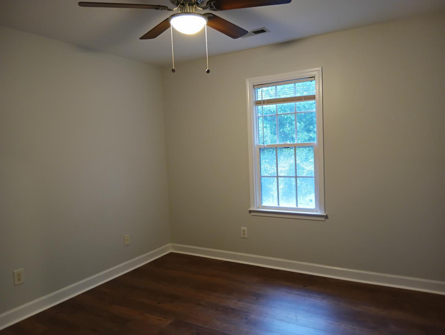 2245 Long Pine Lane Raleigh, NC 27603 - Photo 26 of 33 an empty room with wooden floor fan and windows
