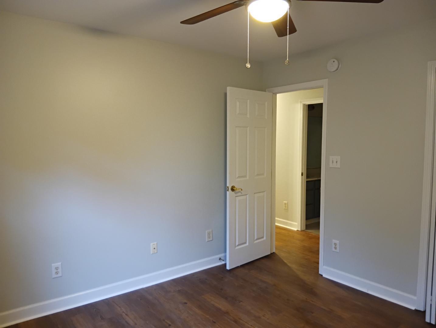 2245 Long Pine Lane Raleigh, NC 27603 - Photo 29 of 33 an empty room with wooden floor closet and chandelier fan
