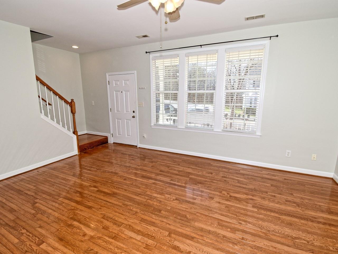 2245 Long Pine Lane Raleigh, NC 27603 - Photo 3 of 33 a view of an empty room with wooden floor and a window