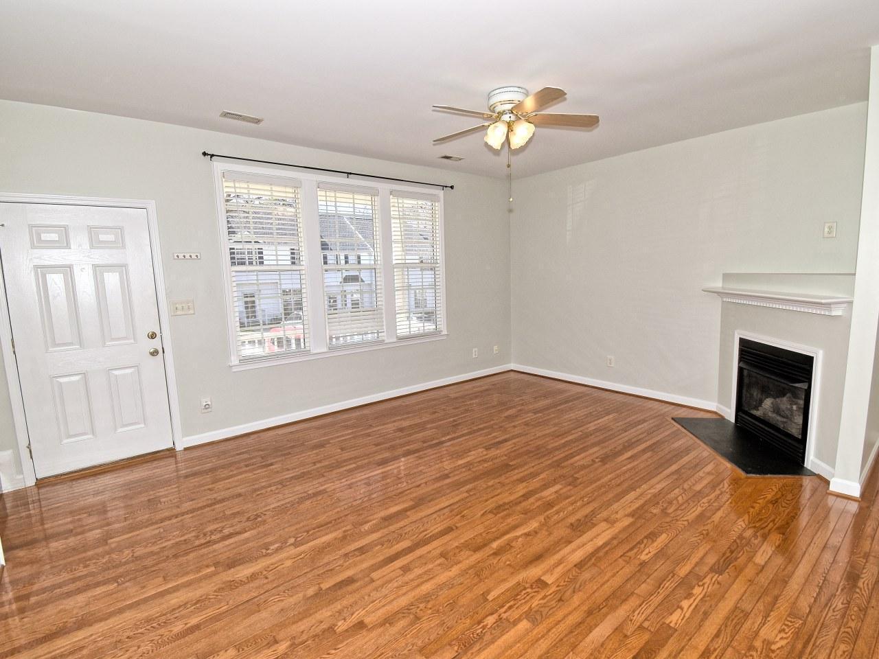 2245 Long Pine Lane Raleigh, NC 27603 - Photo 5 of 33 a view of empty room with wooden floor and fan