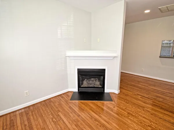 a room with a fireplace and a fireplace