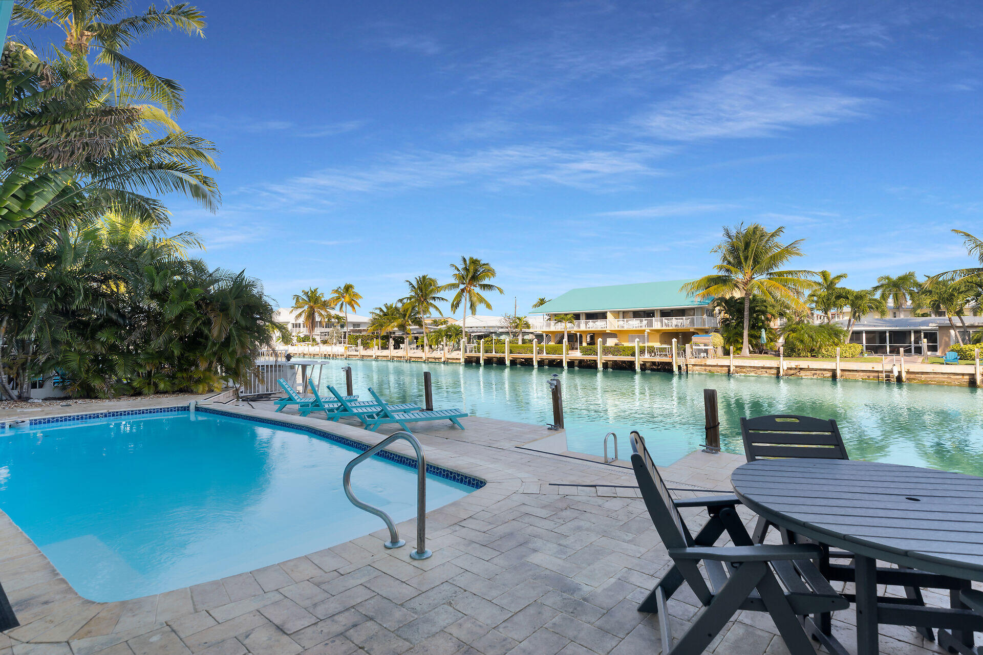 580-590 10th Street Key Colony Beach, FL 33051 - Photo 67 of 75 a view of a chairs and table on the terrace