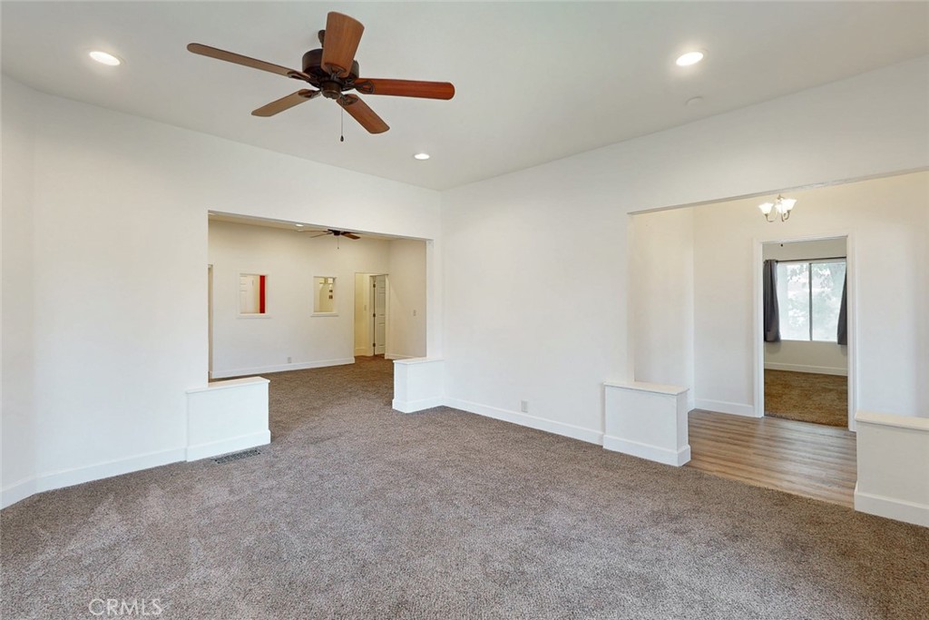 1585 Sycamore Street Gridley, CA 95948 - Photo 14 of 66 a view of a livingroom with a ceiling fan and kitchen space