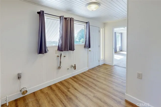 a view of a livingroom with a ceiling fan and window
