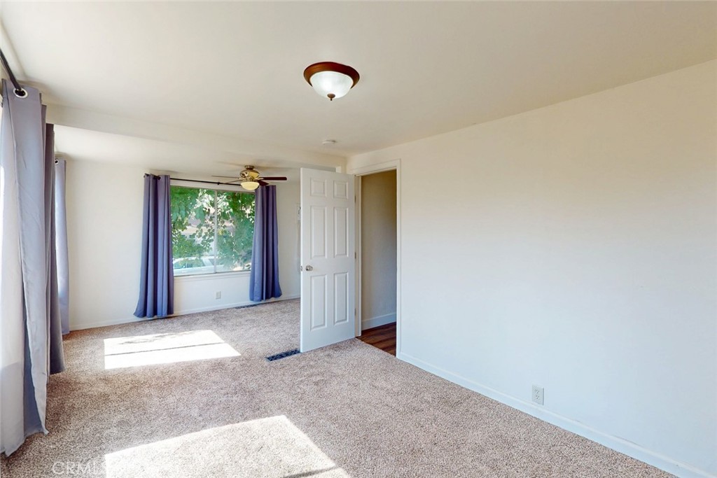 1585 Sycamore Street Gridley, CA 95948 - Photo 19 of 66 a view of a big room with windows and closet