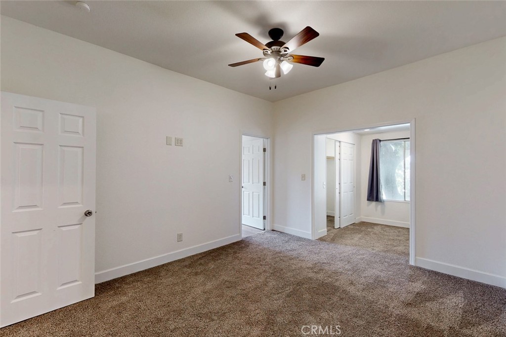 1585 Sycamore Street Gridley, CA 95948 - Photo 24 of 66 an empty room with chandelier fan