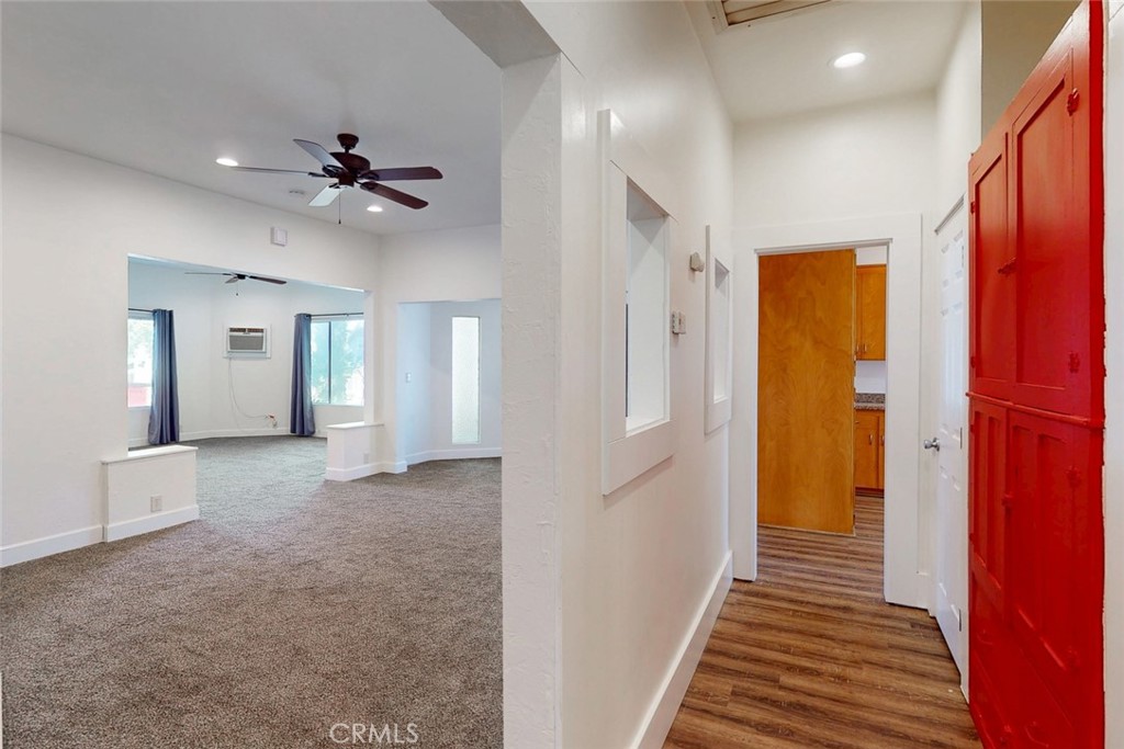 1585 Sycamore Street Gridley, CA 95948 - Photo 26 of 66 a view of a hallway with wooden floor and staircase