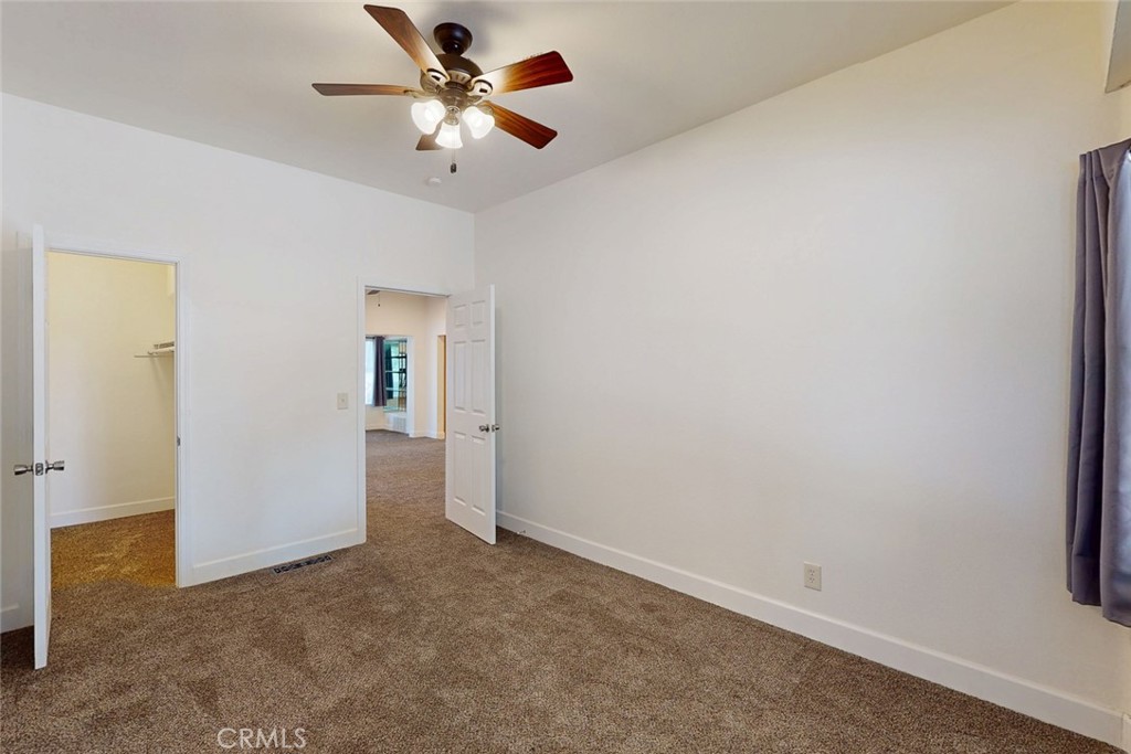 1585 Sycamore Street Gridley, CA 95948 - Photo 27 of 66 an empty room with closet and a ceiling fan