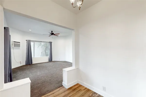 a bathroom with a granite countertop sink a toilet and bathtub