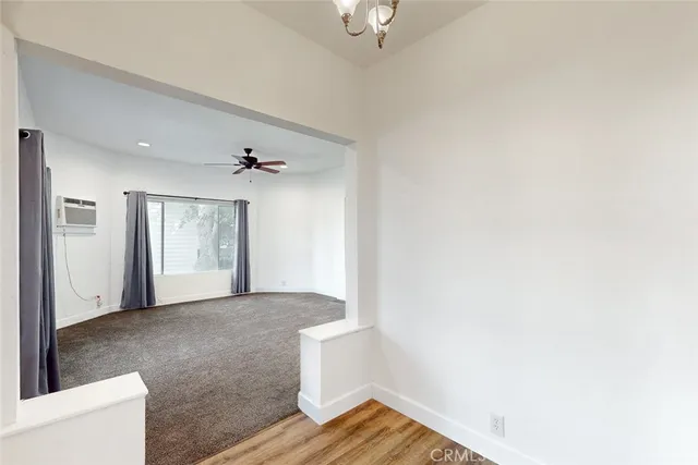 a bathroom with a granite countertop sink a toilet and bathtub