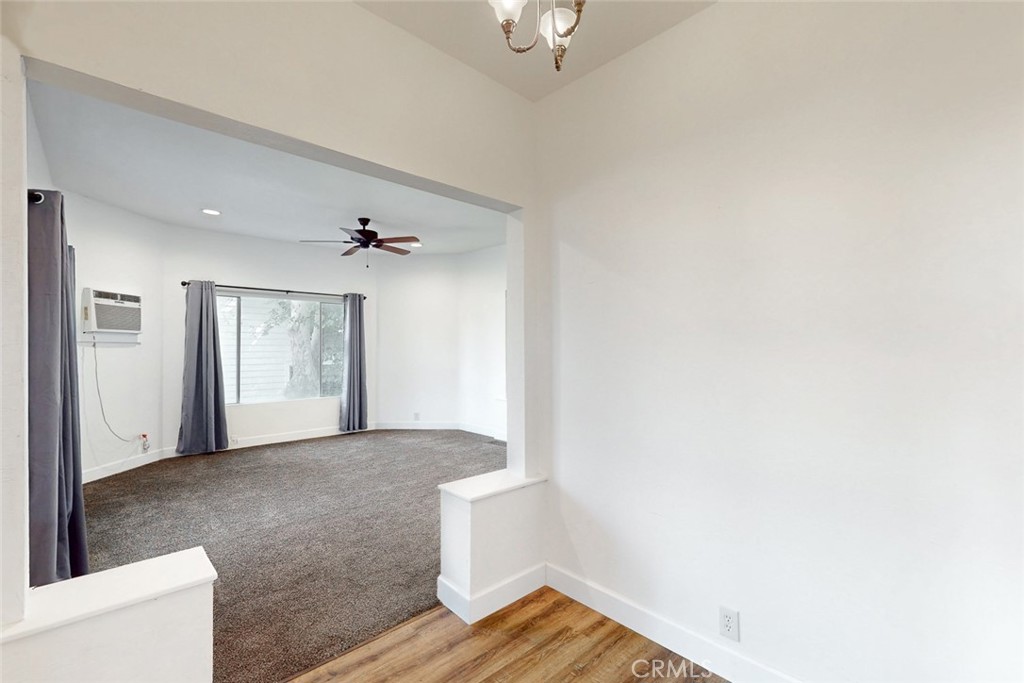1585 Sycamore Street Gridley, CA 95948 - Photo 29 of 66 a view of a livingroom with wooden floor and a ceiling fan