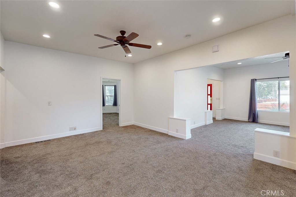 1585 Sycamore Street Gridley, CA 95948 - Photo 30 of 66 an empty room with windows and ceiling fan