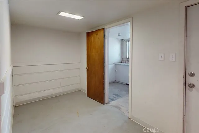 a view of a house with a yard and tree s