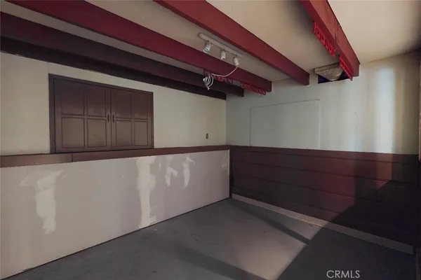 a view of backyard with wooden fence