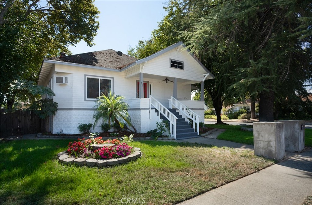 1585 Sycamore Street Gridley, CA 95948 - Photo 49 of 66 a front view of a house with a garden and trees