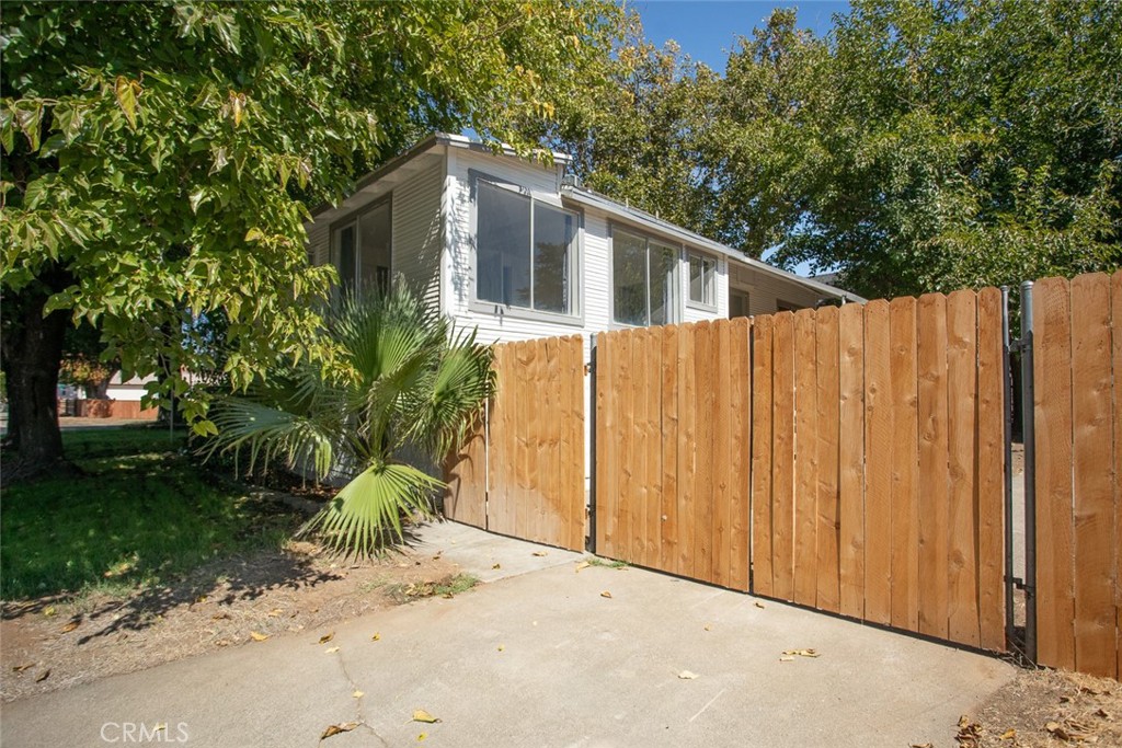 1585 Sycamore Street Gridley, CA 95948 - Photo 53 of 66 a front view of a house with a yard and garage