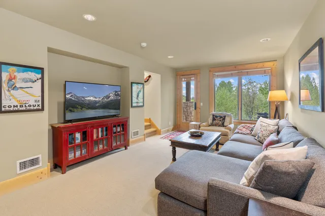 a view of a porch with wooden floor and bench