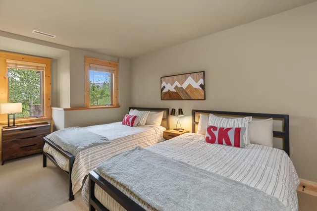 a bathroom with a granite countertop sink a mirror and a bathtub