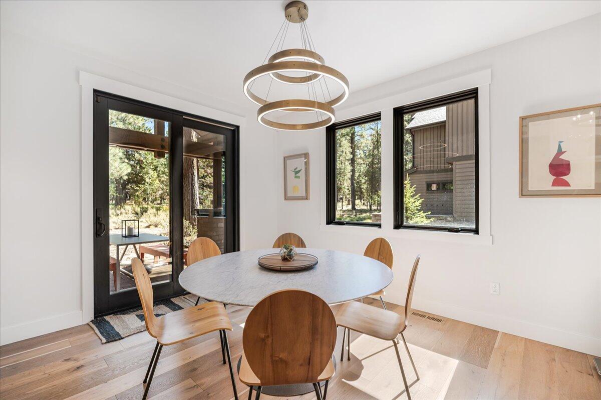 56278 Sable Rock Loop Bend, OR 97707 - Photo 17 of 54 a dining room with furniture and window