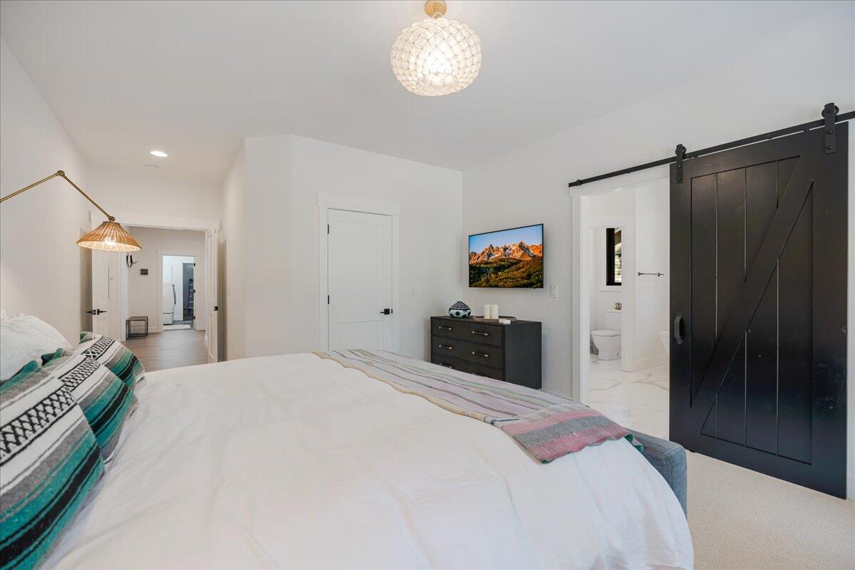 56278 Sable Rock Loop Bend, OR 97707 - Photo 20 of 54 a bedroom with a bed and a television