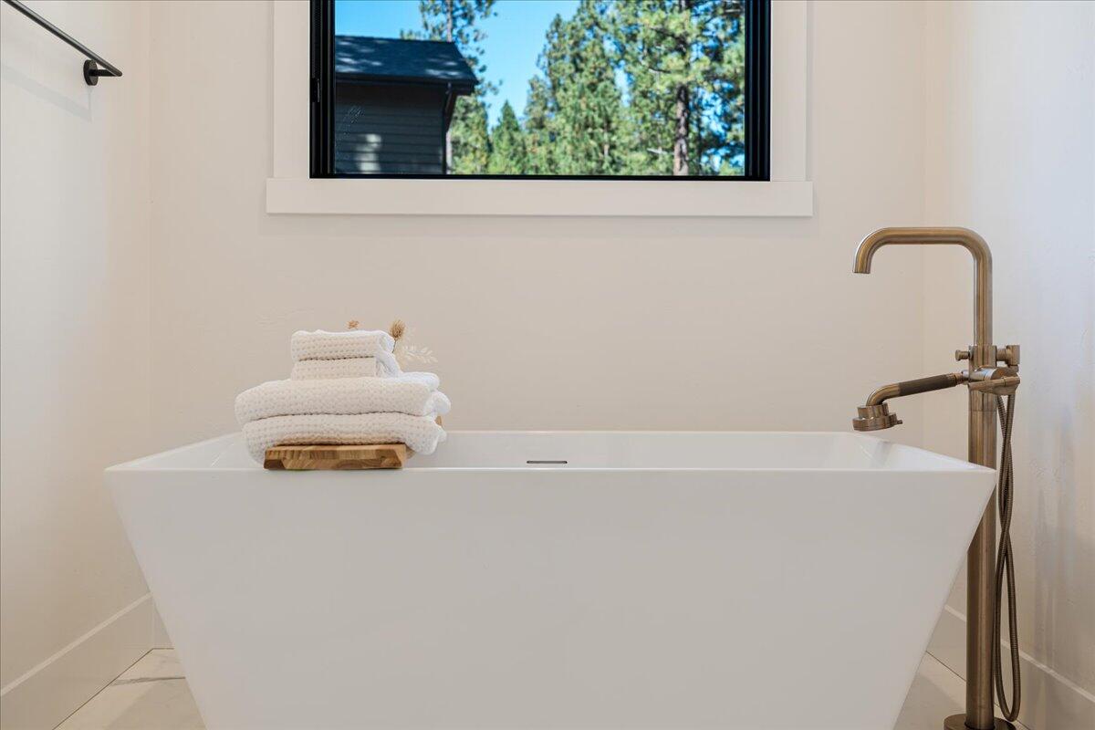 56278 Sable Rock Loop Bend, OR 97707 - Photo 21 of 54 a bathroom with a sink and a window