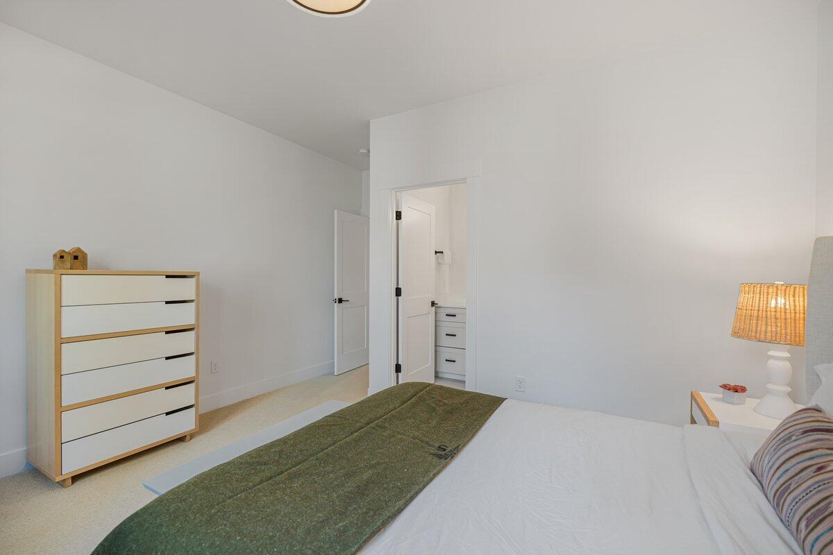 56278 Sable Rock Loop Bend, OR 97707 - Photo 28 of 54 a bedroom with a bed and dresser