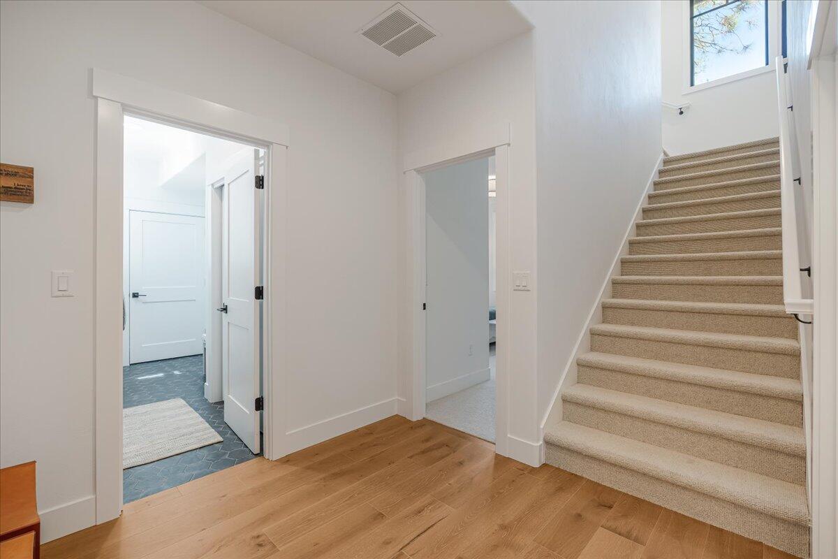 56278 Sable Rock Loop Bend, OR 97707 - Photo 32 of 54 a view of a hallway with wooden floor and entryway